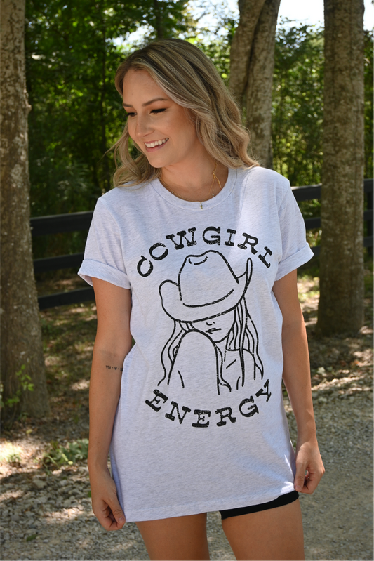 Model is wearing the "cowgirl energy" heather gray graphic. Upclose view of the tee. 