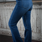 A close up side shot of the high rise bootcut kancan jeans.