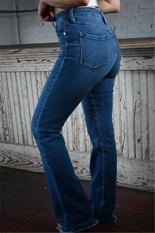 A close up side shot of the high rise bootcut kancan jeans.