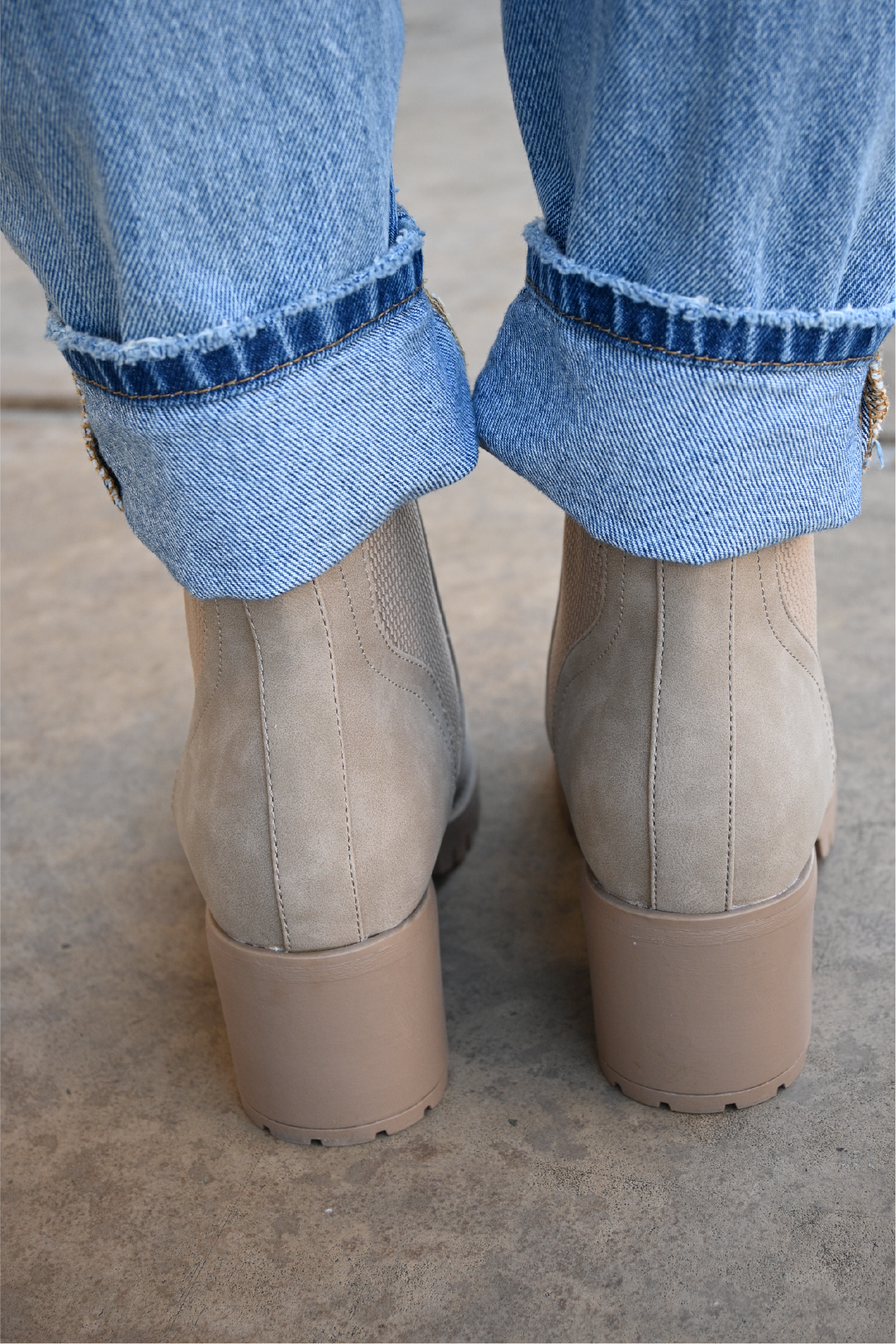 a back view of the sahara slip on booties paired with the 90's high rise jeans cuffed