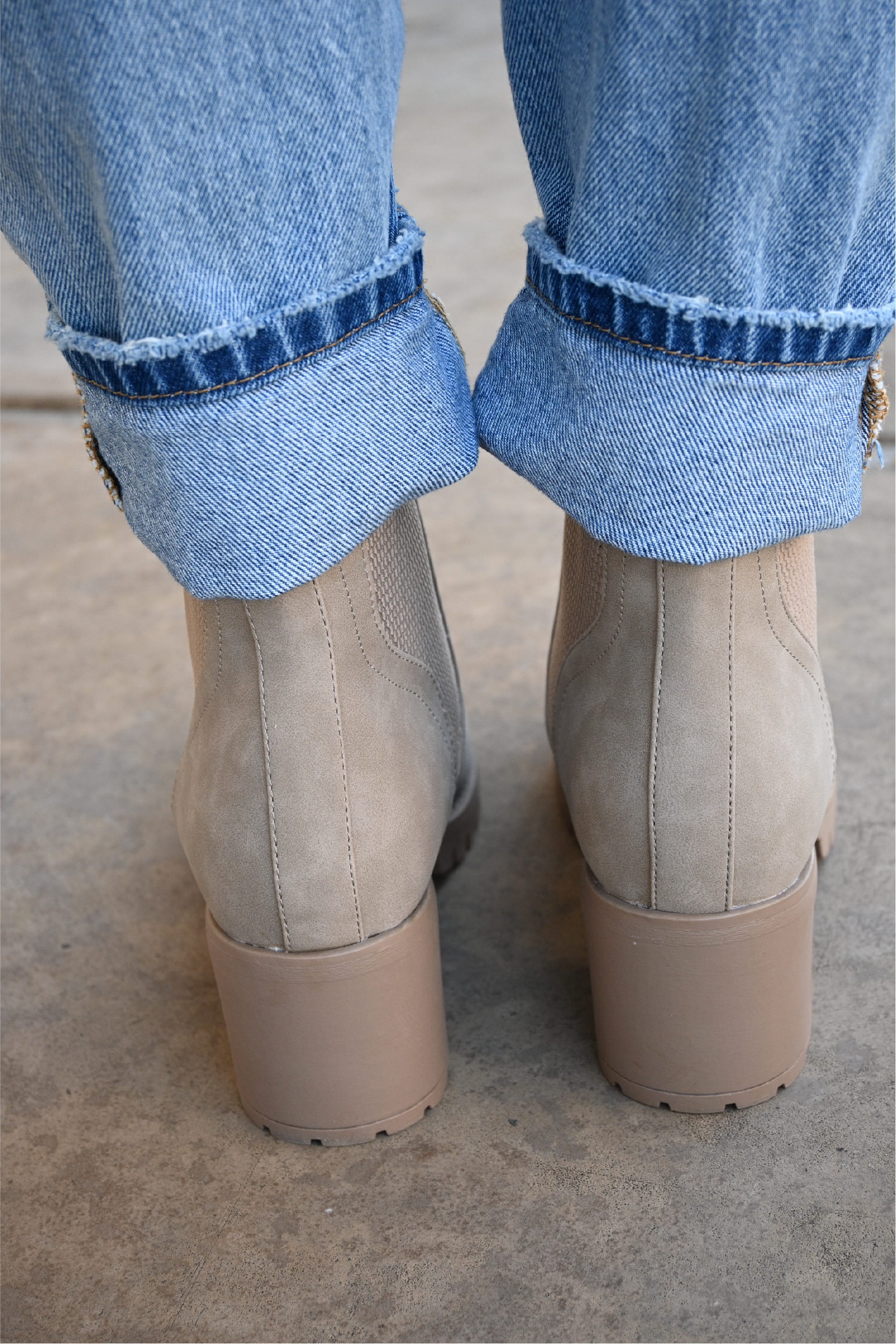 a back view of the sahara slip on booties paired with the 90's high rise jeans cuffed